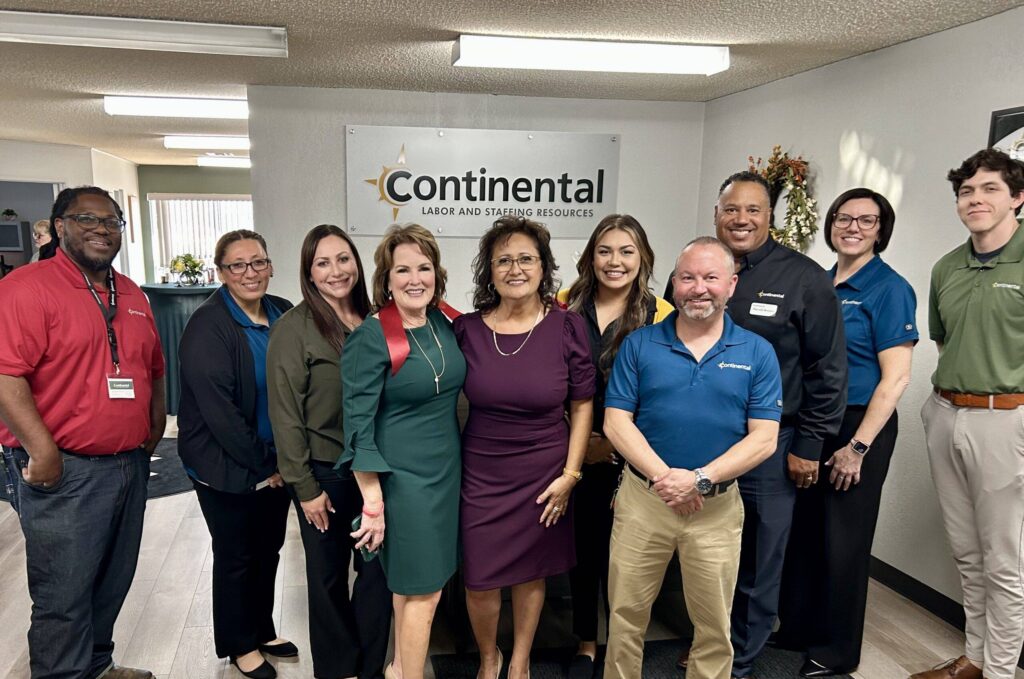 The team celebrating the remodel of the office in September 2025